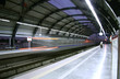 metro zooming past station, delhi, india metro zooming past station, delhi, india