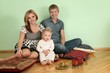 family sit on floor on pillow