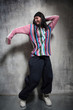 the dancer posing on dark grey background the dancer posing on dark grey background