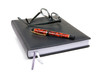 Black bound note pad with reading glasses and fountain pen Black bound note pad with reading glasses and fountain pen