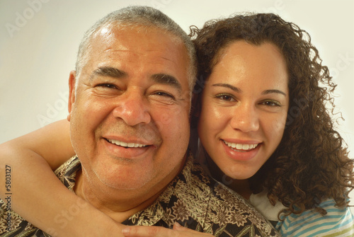 Photo: Studio portrait of father and daughter laughing and being happy Studio portrait of father and daughter laughing and being happy