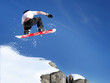 Snowboarder jumping high in the air