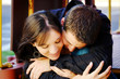 Couple Hugging. Heads Down.
