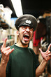 Adult man in military service cap shouting