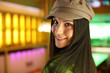 Portrait of a hip beautiful young woman in cap hat.