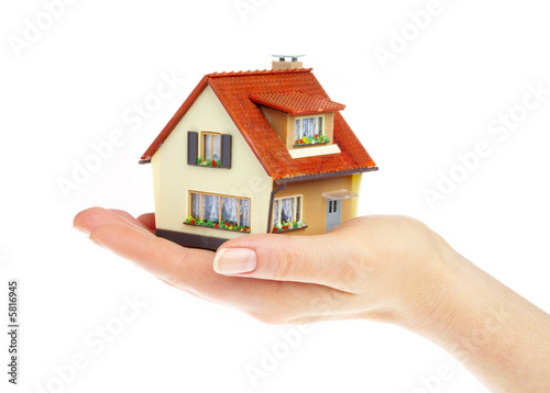 Photo: The house in human hands The house in human hands