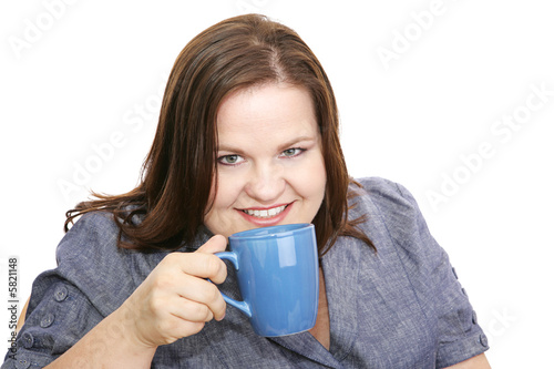 Photo: Beautiful plus-sized model enjoying a cup of coffee. Beautiful plus-sized model enjoying a cup of coffee.