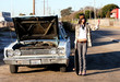 Young woman having car problems
