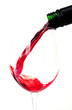 Red wine pouring into a glass