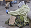 homeless man with sign