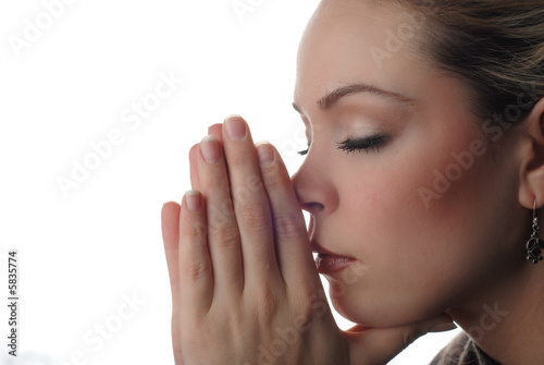Photo: a woman is praying to god with hope a woman is praying to god with hope
