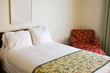 Bed and chair in a business travel hotel room