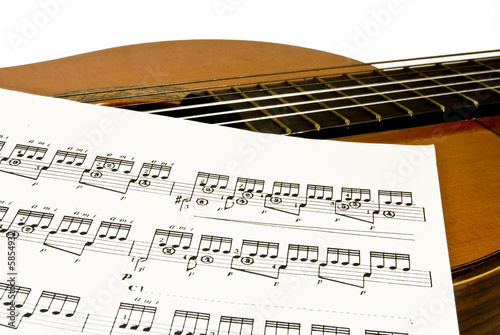 Photo: classical (spanish)guitar and music sheet classical (spanish)guitar and music sheet