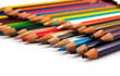 Assortment of coloured pencils on white background