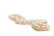 Pearl necklace on white - shallow depth of field