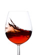 Isolated and moving red wine glass over a white background