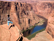 A young woman in her early '20s enjoys hiking the Grand Canyon