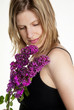 a young woman with top and pink syringa