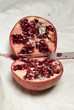 Pomegranate fruit being cut up to eat