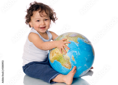 Happy baby with globe.