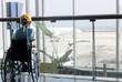 invalid boy is looking at the airplane ithe airport