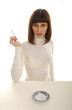 Photo: Young Smoking woman in white dress with white cigarette. Young Smoking woman in white dress with white cigarette.