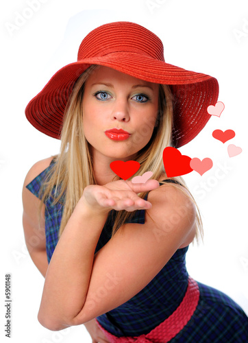 Photo: young beautiful woman blowing kissed to her valentines young beautiful woman blowing kissed to her valentines