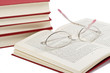 book with glasses on it isolated