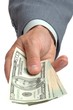 Photo : Hand offering dollars 