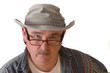 Middle-aged man with glasses and a hat isolated on white