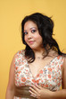 Elegant young woman in a cute summer dress