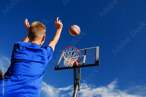 Photo: Boy playing basketball Boy playing basketball