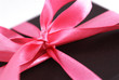 Close up shot of a gift box with Pink ribbons