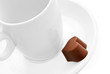 Heart off chocolate and a coffee cup.