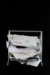 Messy in-basket with papers Messy in-basket with papers