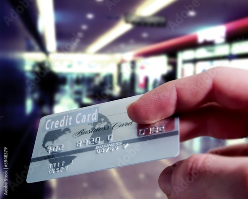 Photo: Purchasing with a credit card in a shopping mall Purchasing with a credit card in a shopping mall