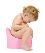 Foto: Pretty baby look in pink potty . Isolate on white Pretty baby look in pink potty . Isolate on white
