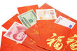 Multi national currency notes in Chinese red packets 