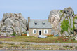 Cottage between rocks, brittany, france.
