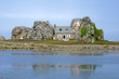 Cottage between rocks, brittany, france.