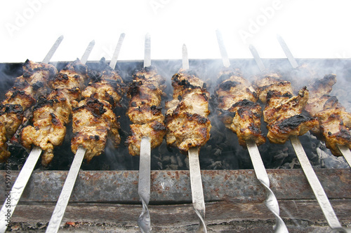 meat kababs on grill isolated over white