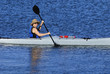 Photo: Cute young woman in straw hat is kayaking in idyllic blue waters Cute young woman in straw hat is kayaking in idyllic blue waters