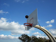 Basketball in air over rim