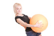 young woman with a ball goes in for fitness