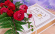 Roses With Bible and Wedding Rings on Wood Table