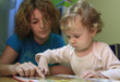 A mother is teaching her child.