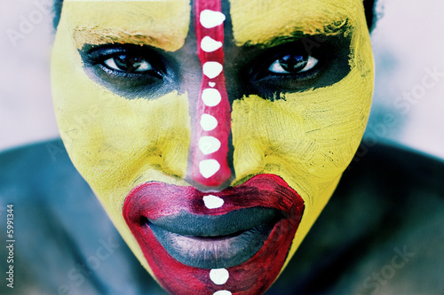 Photo: Young African woman painted traditional, lomography look Young African woman painted traditional, lomography look