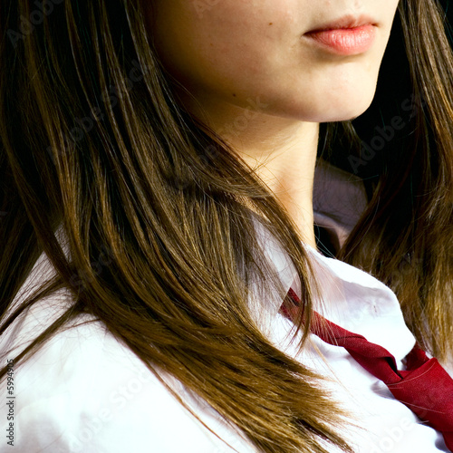 Girl wearing red necktie