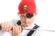 Child play acting a Pirate, wearing eye patch, wielding  sword 