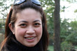 An Asian Girl smiling outdoors An Asian Girl smiling outdoors